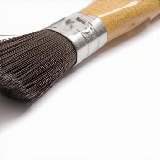 Close-up of a handcrafted custom paintbrush showing mixed bristle types and ergonomic handle design.